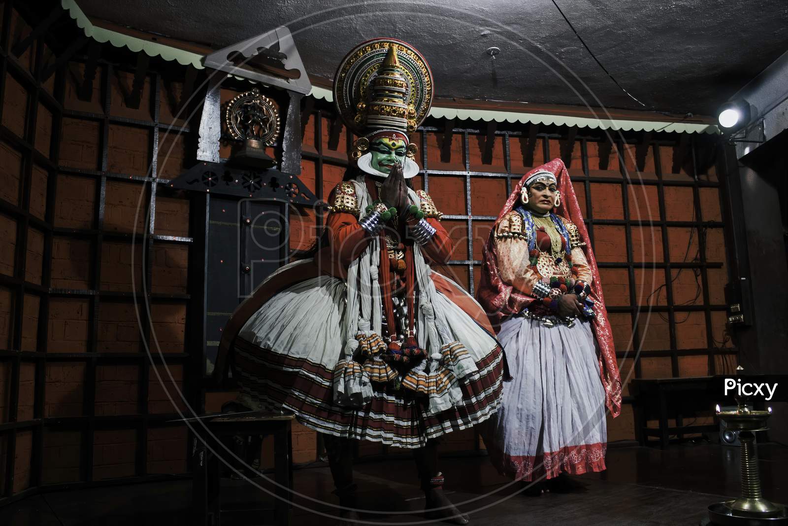 Kochi, India - March 15, 2014: An Indian Classical Dance Form Named Kathakali Artists Tells Indian Mythological Stories Through Numerous Gestures Techniques And Emotions In Front Of European Tourists.