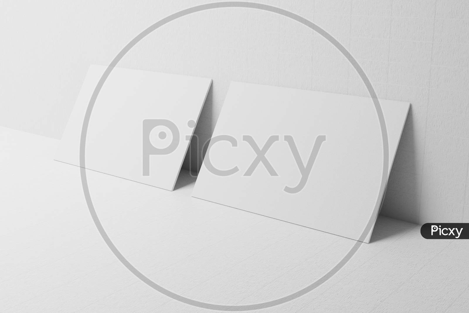 White Business Card Paper Mockup Lean On Wall Template With Blank Space Cover For Insert Company Logo Or Personal Identity On Cardboard Background. Modern Stationary Concept. 3D Illustration Render