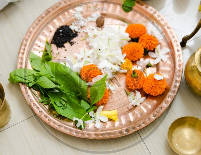 Flowers kept in plate during a ritual of rice ceremony in India