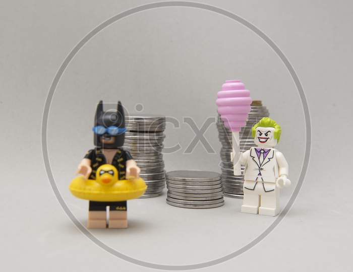 Batman Minifigure With Swimsuit And Vacation And Joker Stealing Money.