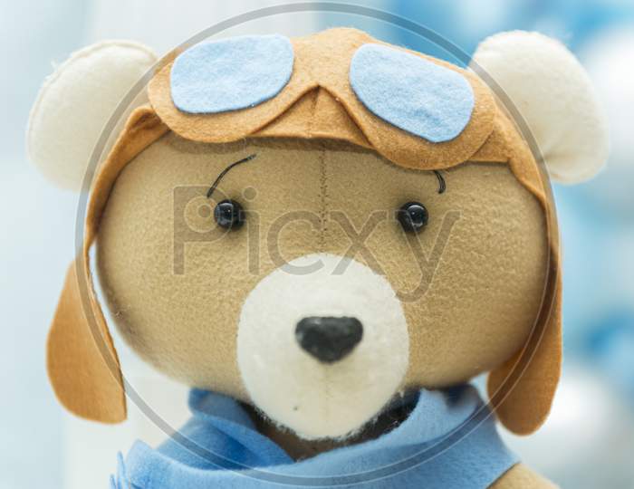 Handsome Bear With Glasses And Vintage Airplane Pilot Helmet. Selective Focus.