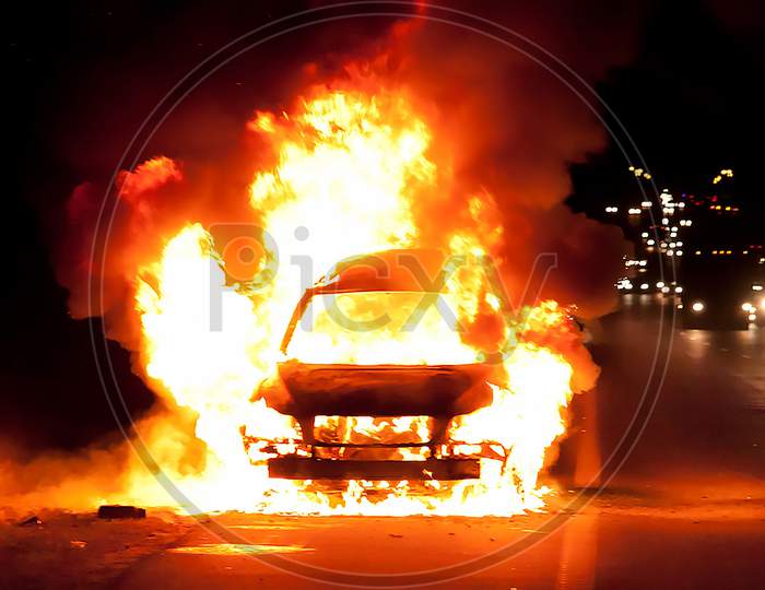 Car On Heavy Fire At Night