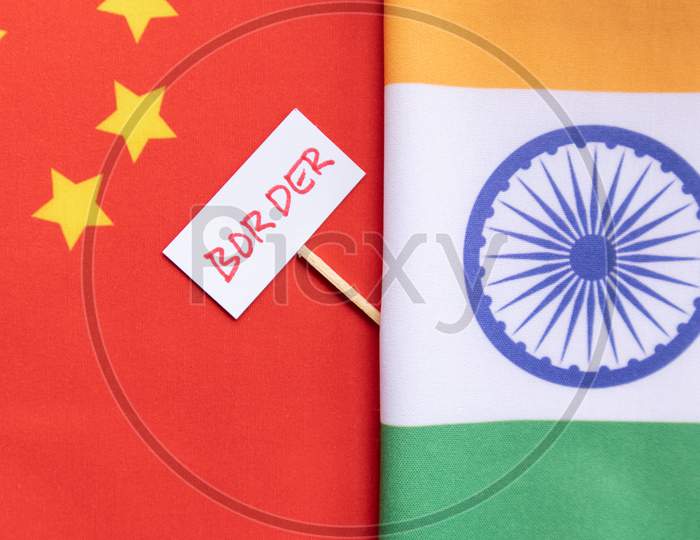 India China border Dispute showing with India and Chinese flag.