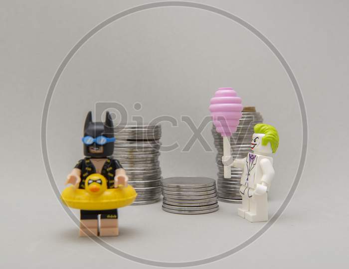 Batman Minifigure With Swimsuit And Vacation And Joker Stealing Money.