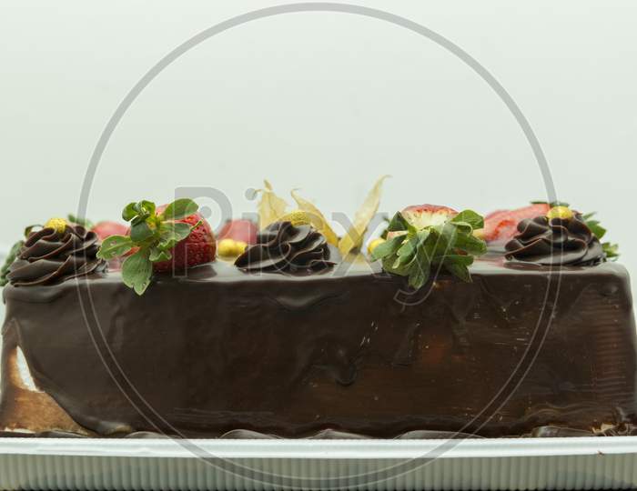 Closeup Of Chocolate Cake With Fruits. Delicious Birthday Party Dessert. Chocolate And Fruits. Festive And Celebration Concept. Selective Focus.