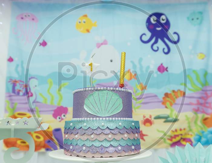 Cake Table Overview Decorated With The Seabed Theme. Children'S Party With Octopus, Seahorse, Oysters, Corals And Colorful Balloons. Party And Fun Concept.