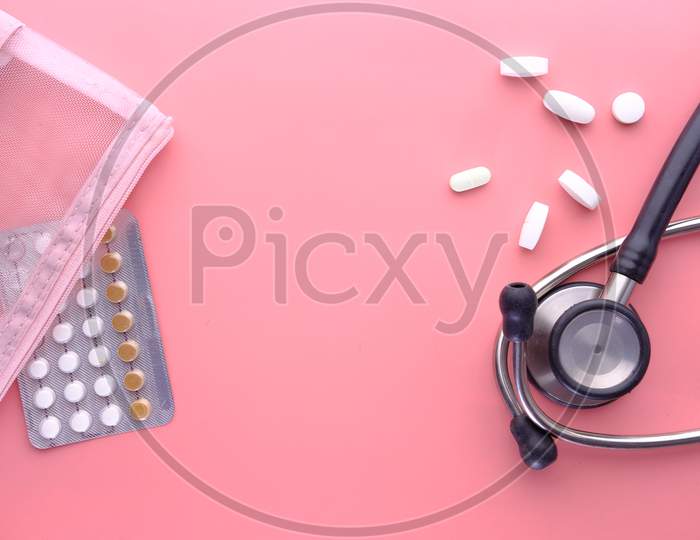 Birth Control Pills On Pink Background, Top View
