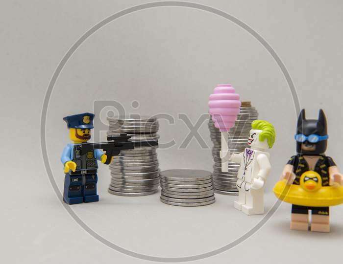 Batman Minifigure With Bathing Suit And Vacation And Joker Being Arrested By The Police.