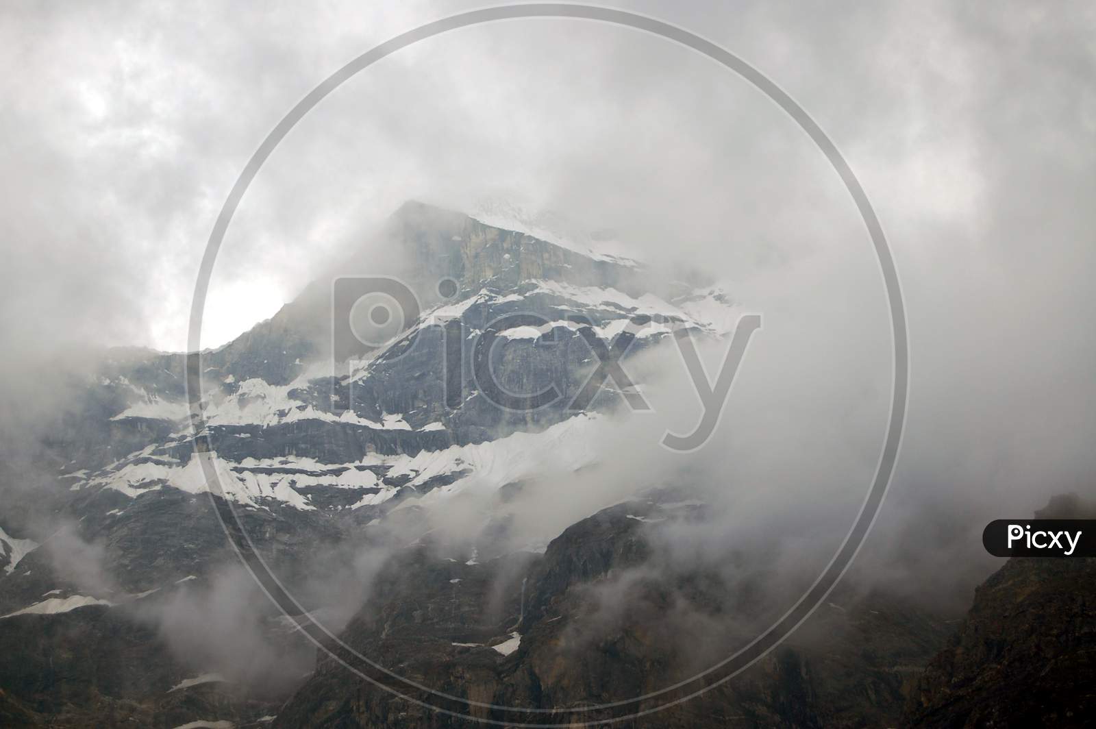 neelkanth mountain covered by rainy clouds