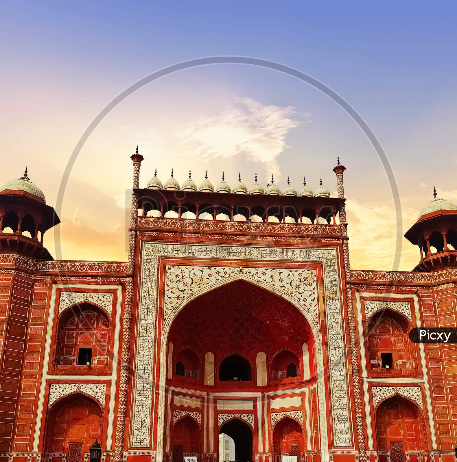 Main entrance gate of the Taj Mahal. Agra, India. It is called the Great Gate. Darwaza-i-rauza is one of the components of the Taj Mahal. sunset time