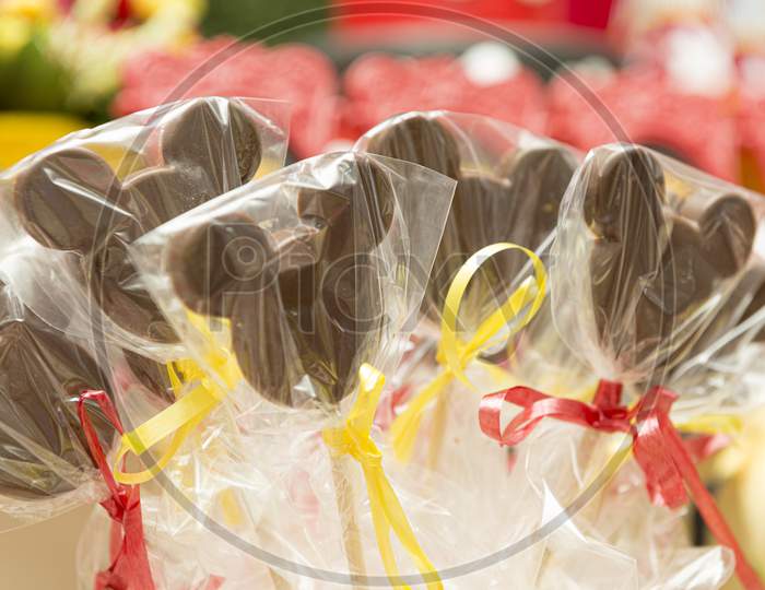 Mickey Mouse Chocolate Lollipops Wrapped In Transparent Plastic Bags