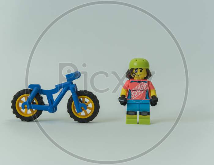 Injured Cyclist Minifigure With Broken Leg Next To His Bike