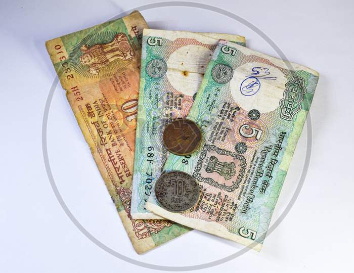Image Of Old Indian Currency Notes And Coins On White Background.