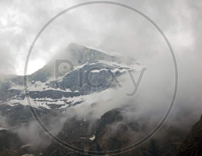 neelkanth mountain covered by rainy clouds