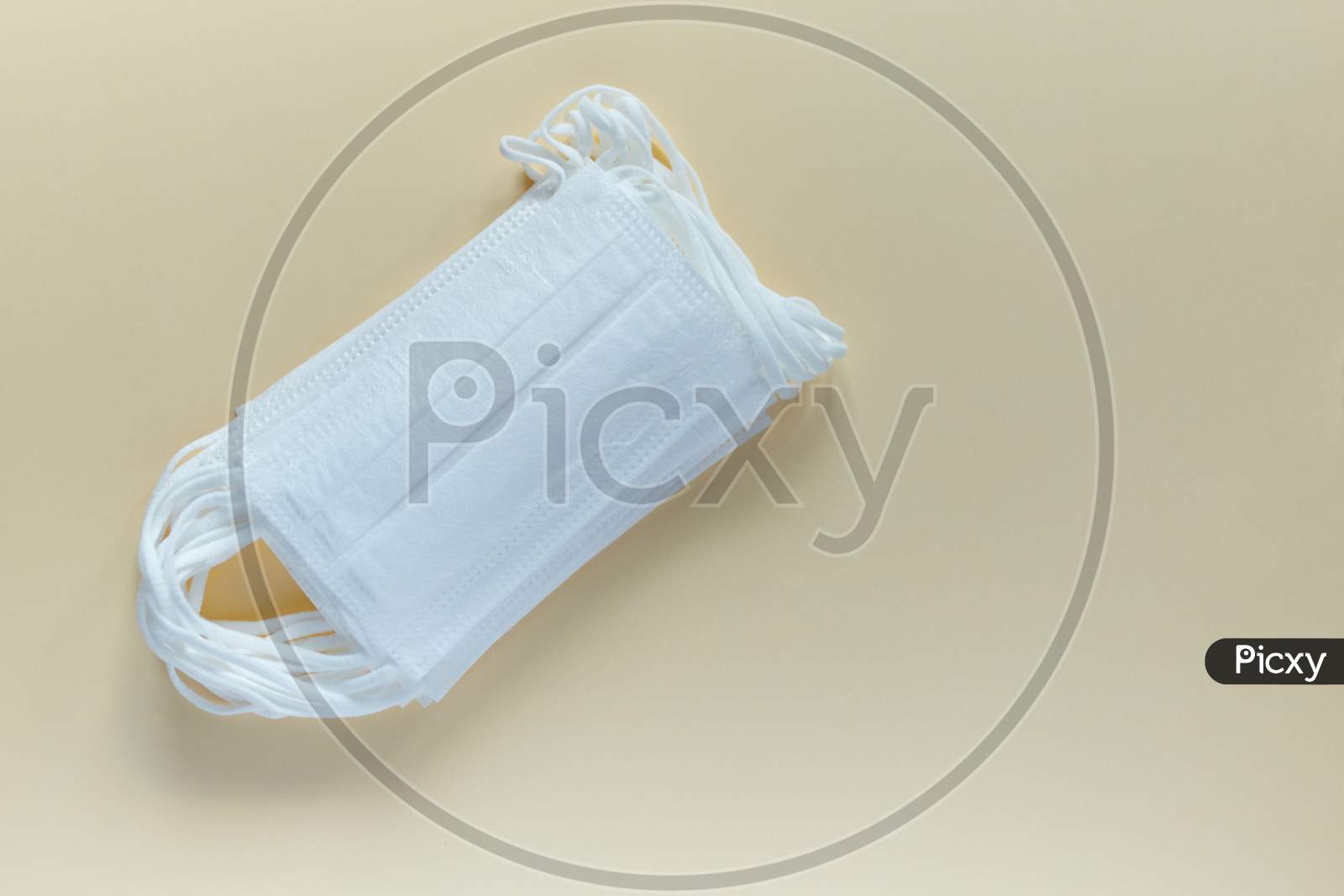 Antiviral Surgical Ear-Loop Masks For Protection Against Corona Virus. Medical Protective Masks On Yellow Background. Protection Concept