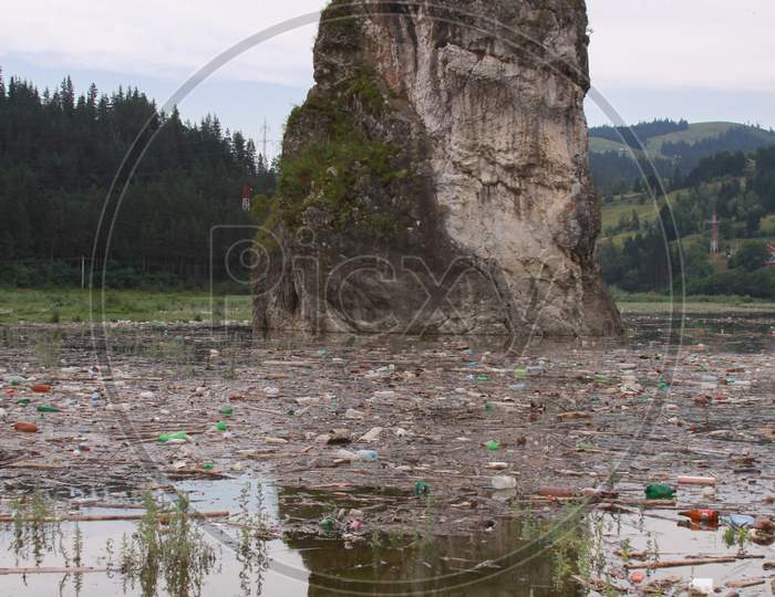 Bicaz Lake Rock Emerging Plastic Polluted Water