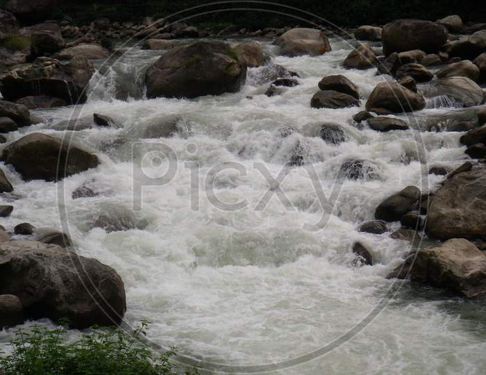 view of a stream gushing through the rocks