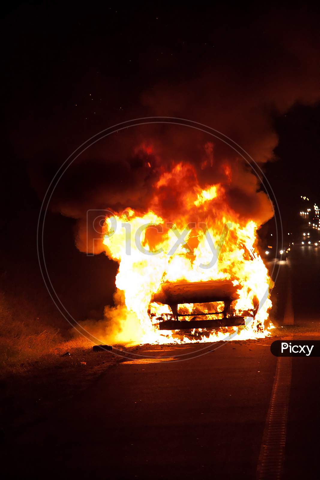 Car On Heavy Fire At Night