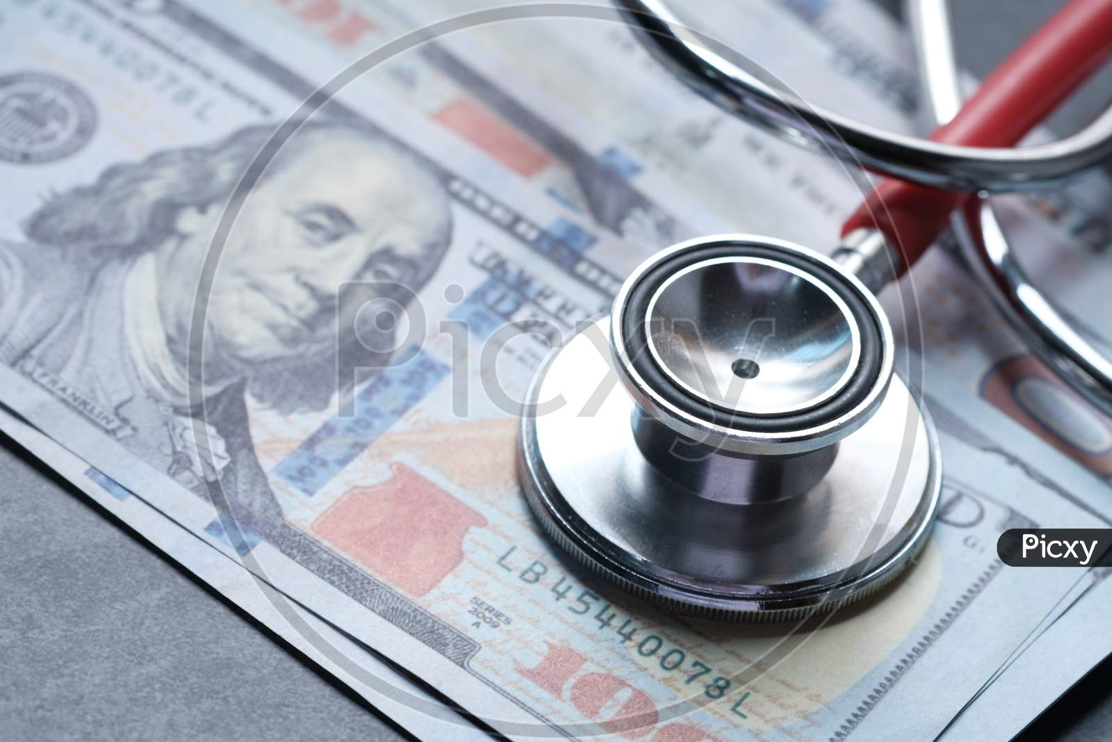 Stethoscope On American Money, High Cost Of Health Insurance.