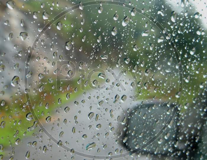 A View Of Rain Drops On The Car Window Pane During The South-West Monsoon, Vattavada, Idukki, Kerala, India