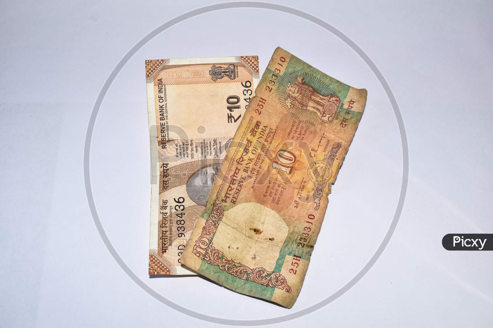 Old 10 Rupees Indian Currency Note And New 10 Rupees Currency Notes Kept Together On White Background.