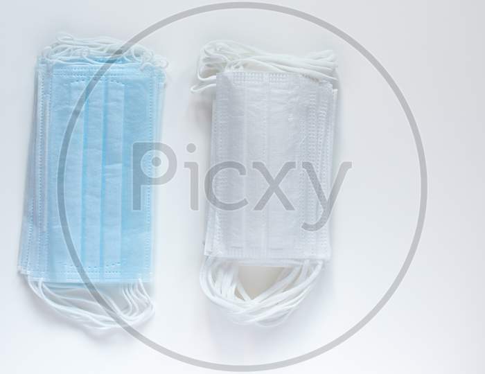 Protective Medical Masks Isolated On White Background. Disposable Surgical Face Mask Cover Mouth And Nose. Coronavirus Quarantine. Hygiene Concept.