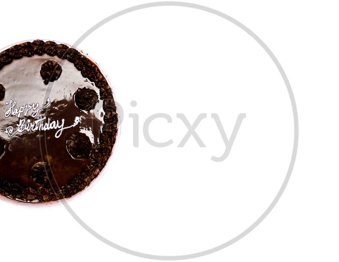 Chocolate Birthday cake with white background and copyspace