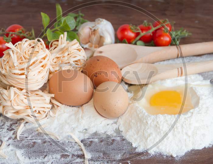 Ingredients Preparation Spaghetti With Eggs, Tomatoes Herbs And Spices