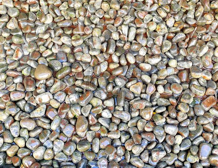Small Pebble Stones On The Shore Of The Sea