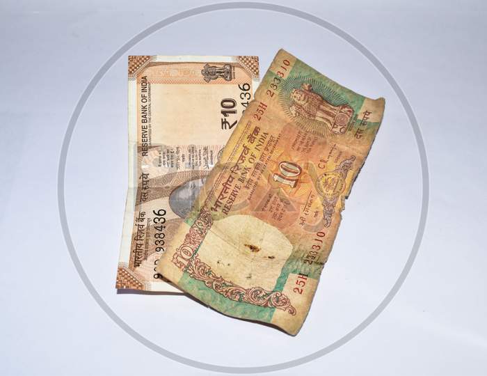 Old 10 Rupees Indian Currency Note And New 10 Rupees Currency Notes Kept Together On White Background.