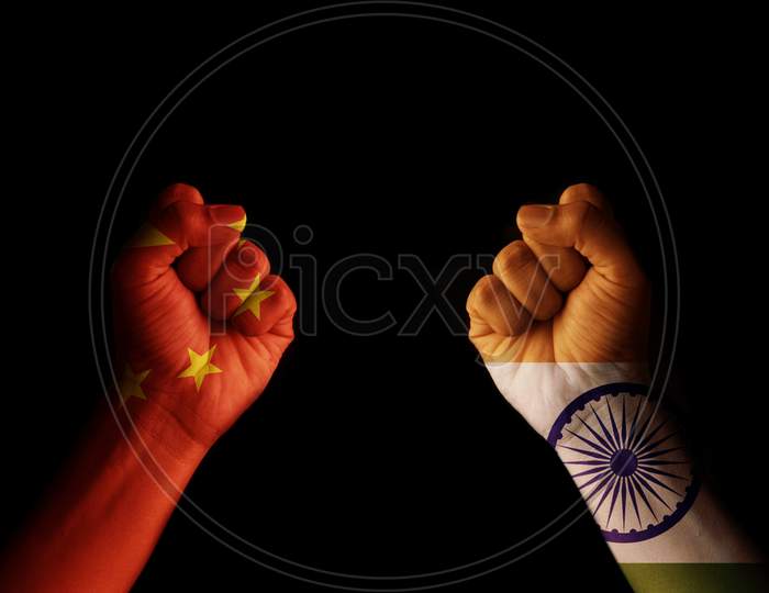 Concept of Dispute or conflict between India and China showing with fist hands.