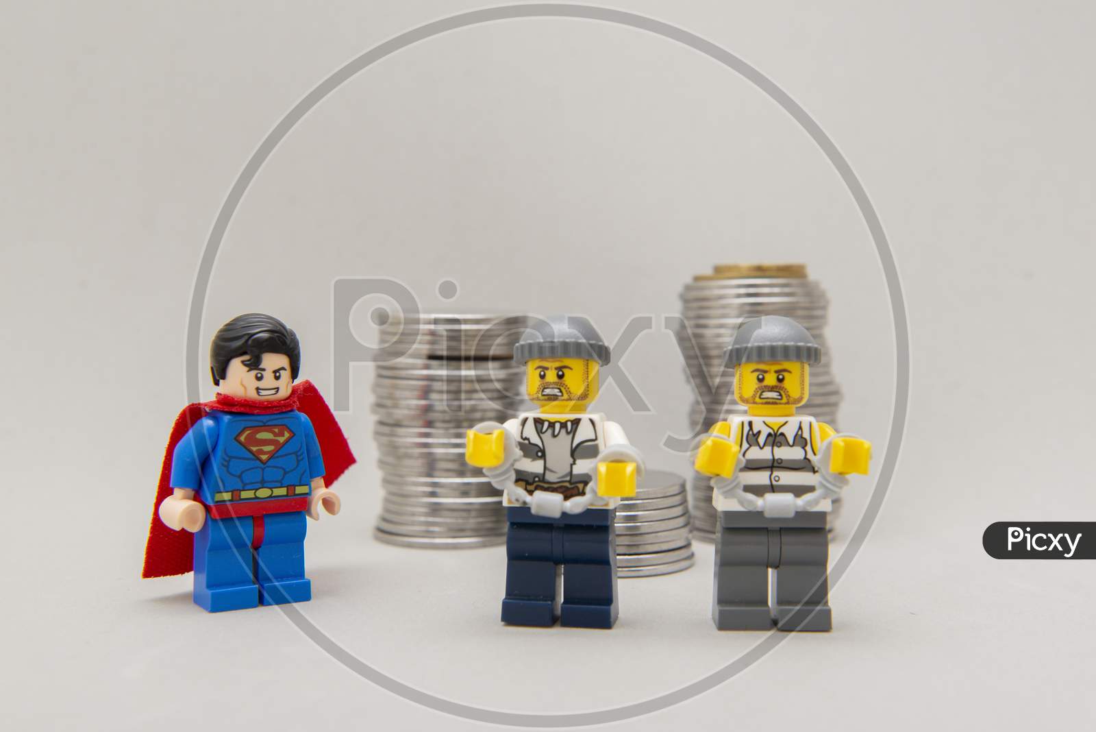 Superman Arresting Two Money Thieves.