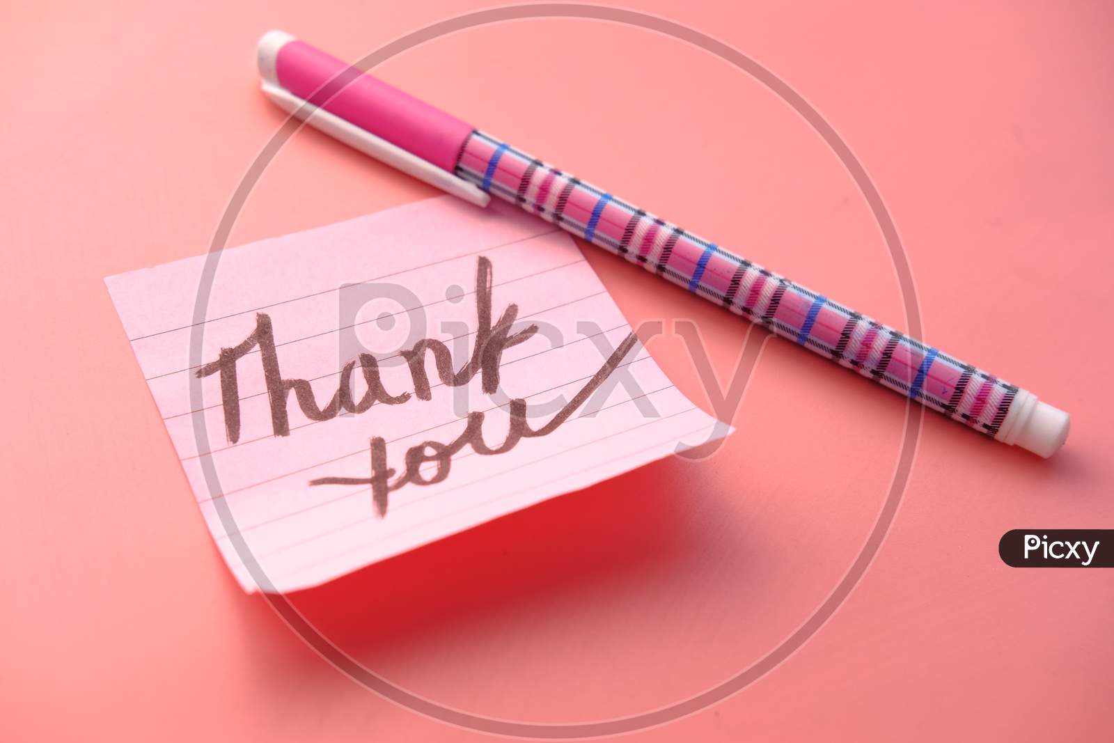 Pink Sticky Note With Thank You On Pink Desk