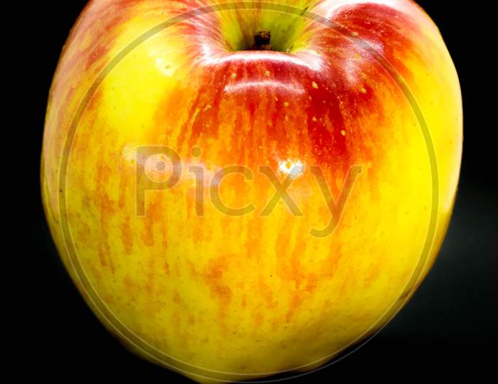 Apple Close-Up. Fresh Apple On Black Background