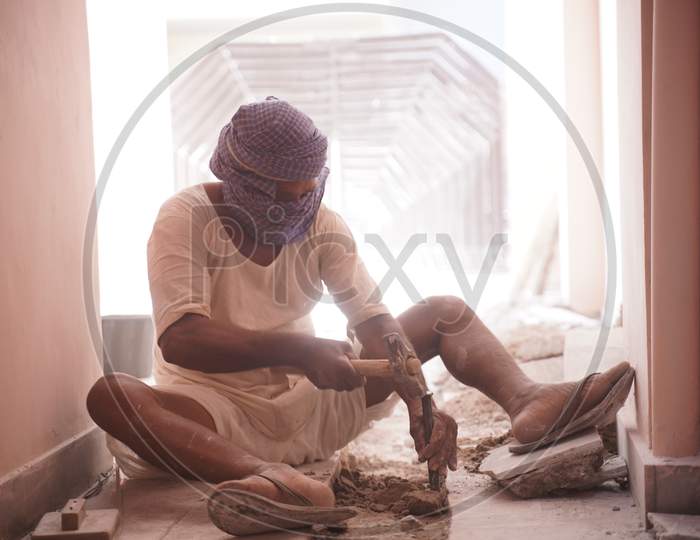jaipur. Rajasthan. India - may 21, 2020 Asia people work hard about construction in factory with wearing mask (covid19 )