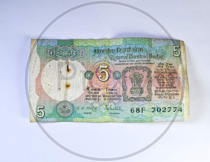 Old 5 Rupees Indian Currency Note On White Background.