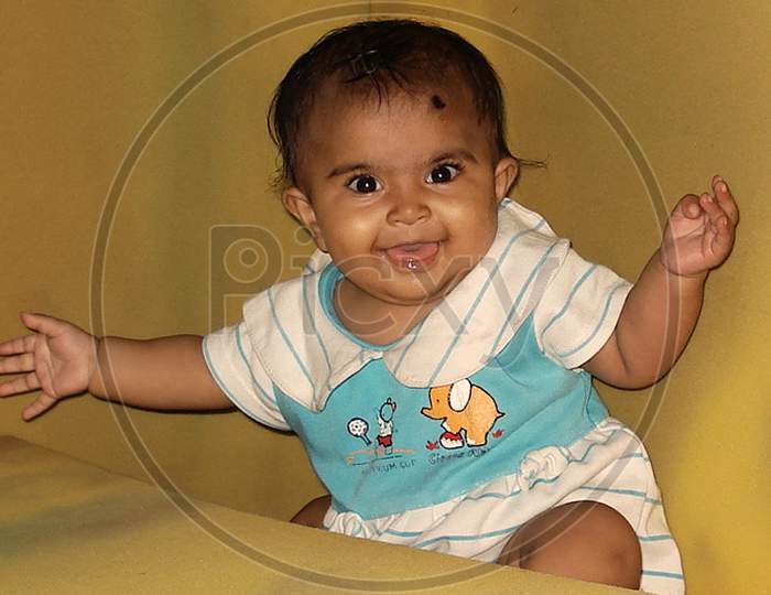 smiling baby in a playful mood in India