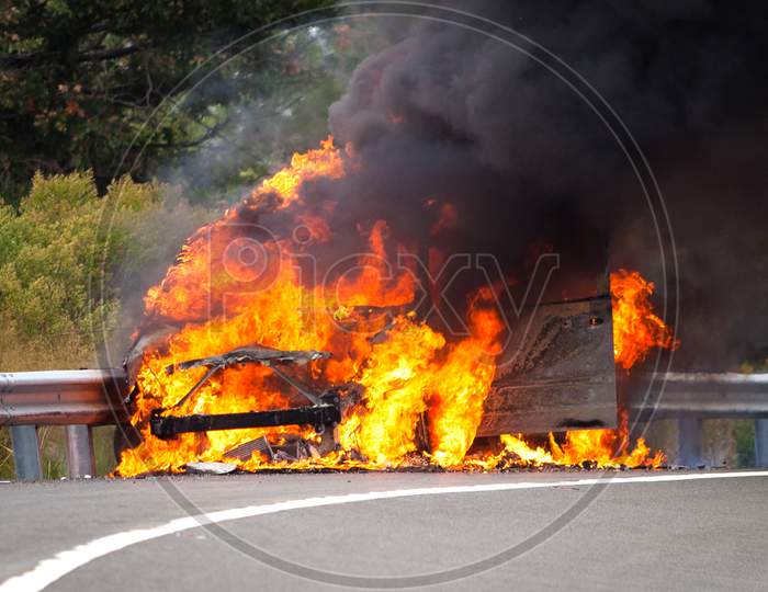 Car On Fire on the road