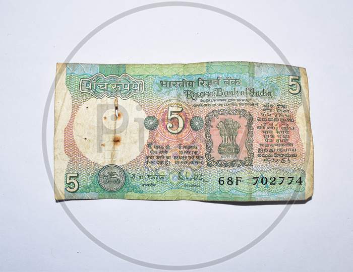 Old 5 Rupees Indian Currency Note On White Background.