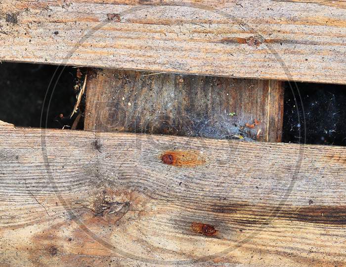 Very Old Wooden Crates With Some Cracks In A Close Up View