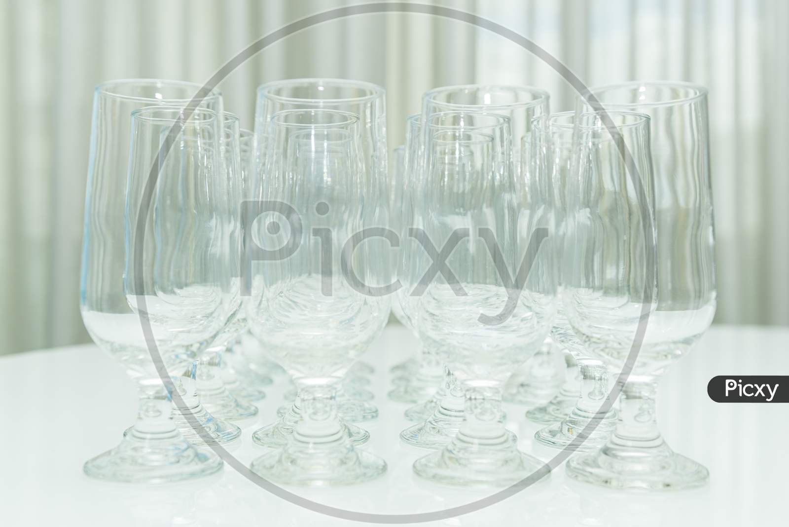 Collection Of Various Glasses For Water And Juice Isolated On White,