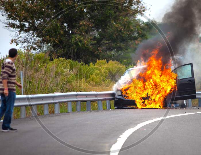 Car On Fire With Passengers