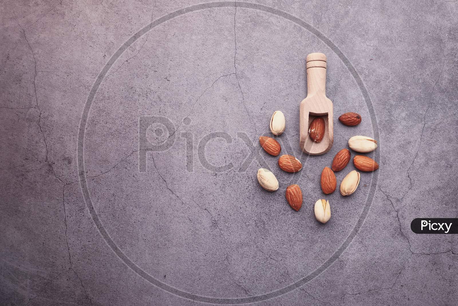 Almond And Pistachios Nut On Gray Background