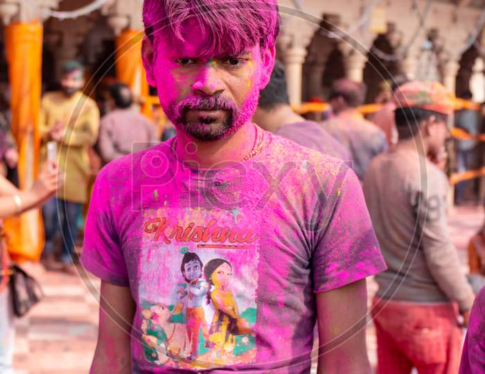 Indian people celebrating Colorful Holi festival at Barsana