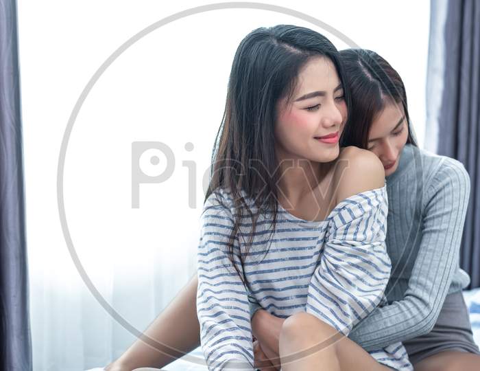 Two Asian Lesbian Women Hug And Embracing Together In Bedroom. Couple People And Beauty Concept. Happy Lifestyles And Home Sweet Home Theme. Homosexual Life Theme. Love Scene Making Of Female