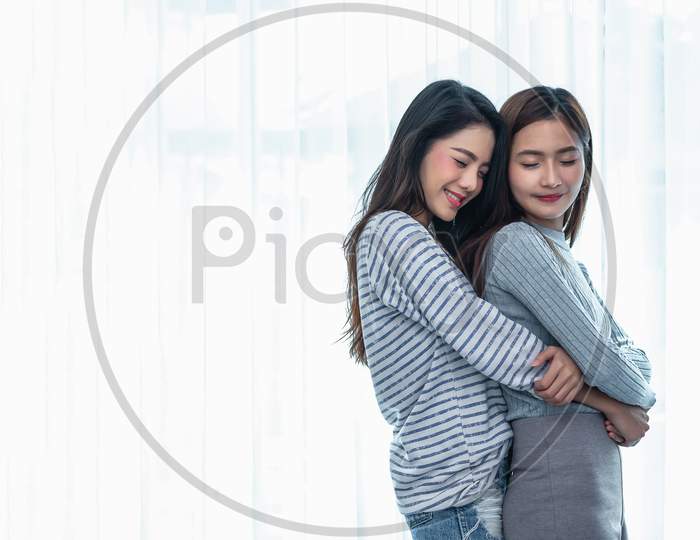 Two Asian Lesbian Women Hug And Embracing Together In Bedroom. Couple People And Beauty Concept. Happy Lifestyles And Home Sweet Home Theme. Homosexual Life Theme. Love Scene Making Of Female