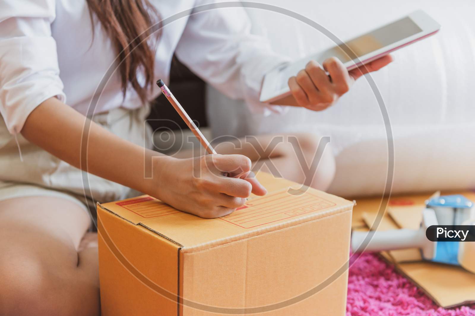Closeup Of Asian Business Woman Hand Startup Small Business Entrepreneur Sme Distribution Warehouse With Parcel Mail Box. Small Owner Home Office. Online Marketing And Product Packaging And Delivery