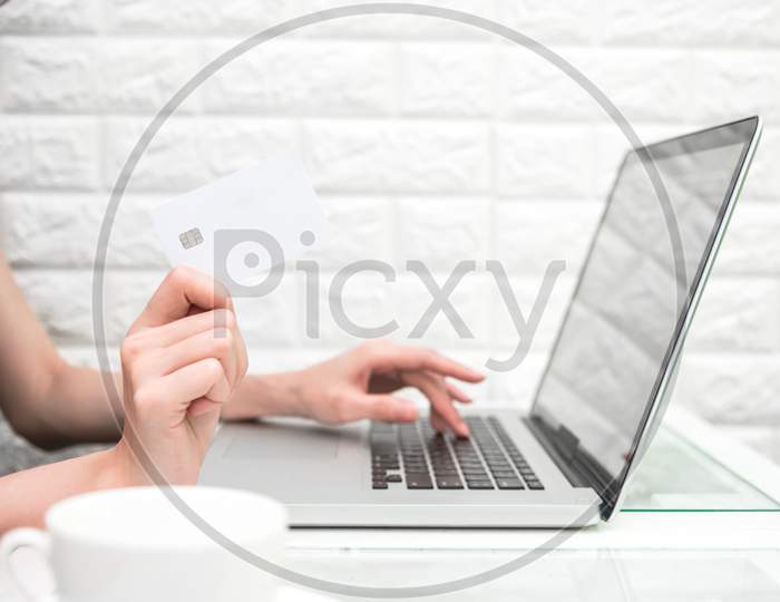 Woman Hands Holding Credit Card For Online Shopping Or Ordering Product From Internet When Using Laptop. Business And Payment Concept. E-Commerce And Internet Security Concept. Home Office And Relax