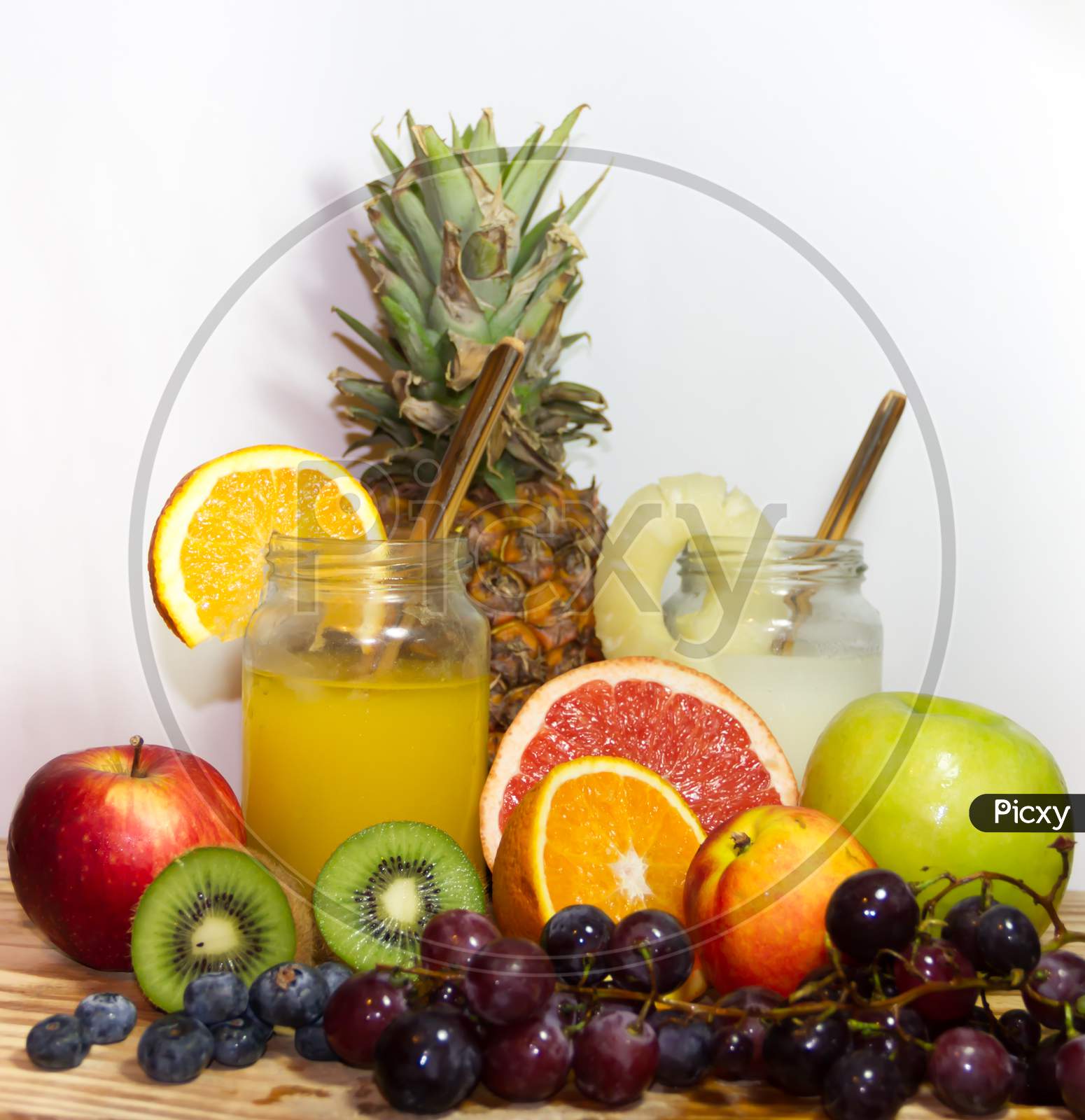 Juices Smoothies And Fresh Pineapple And Orange Drinks With Summer Fruits