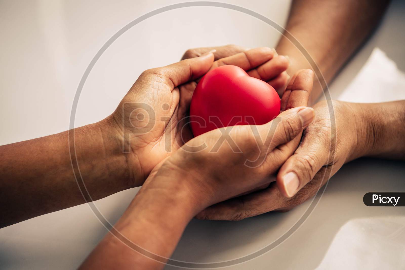 Helping Hand Of Heart Donor For Patient In Heart Disease. Man Give Red Heart To Woman As Couple. People Lifestyle And Couple Romance. Healthcare And Hospital Medical Concept. Symbolic Of Valentine Day